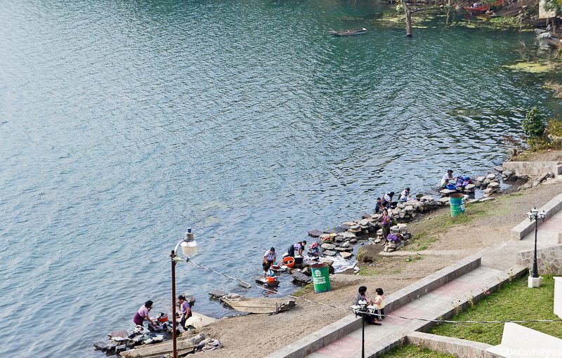 Local ladies washing clothes on the edge of Lake Atitlan