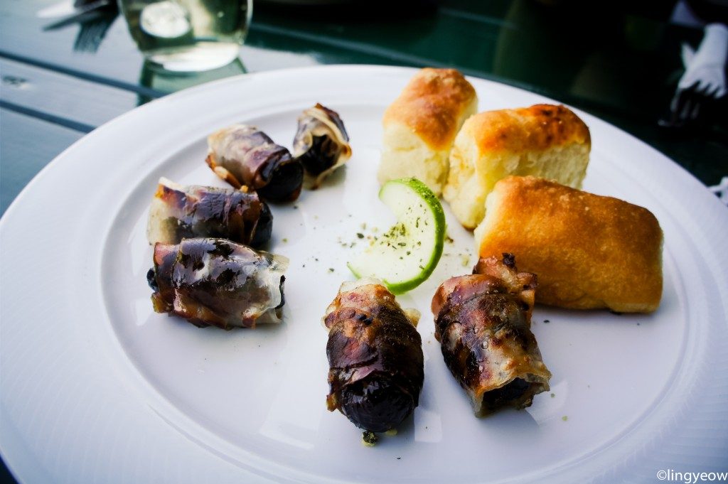 Not your typical pigs in blanket, the bacon wraps around a plum instead