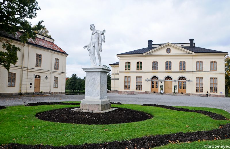 The well preserved theatre building (at the back) standing tall at Drottningholm Palace