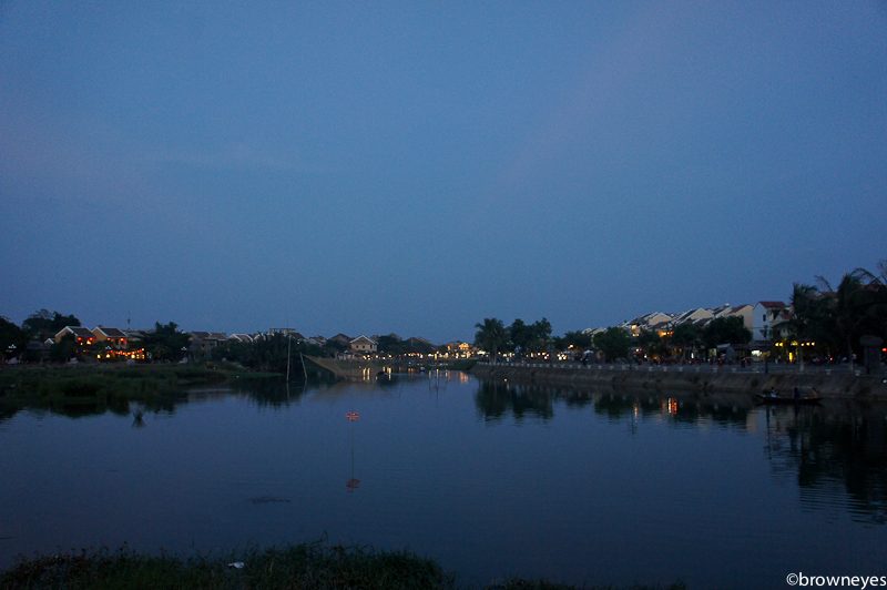 As dusk arrives, the town is lited by lanterns.